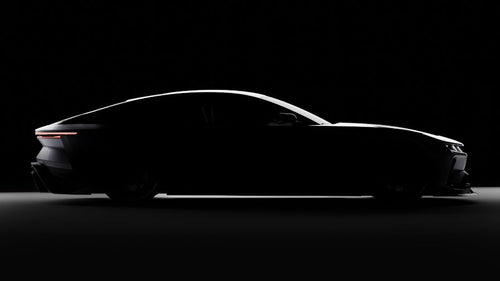 Silhouette of a car against a black background